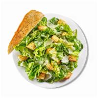 Caesar Side Salad · Crunchy romaine lettuce tossed in Caesar dressing, topped with shaved Parmesan and croutons,...