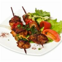 1. 3 Mini Kabobs  · Specially marinated, skewered and broiled over an open flame. Served with parsley and red on...