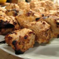 5. A Skewer of Chicken Breast Kabob · Specially marinated, skewered and broiled over an open flame. Served with parsley and red on...
