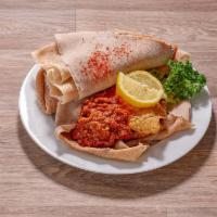 Fillet of Fish · Generous portion of breaded tilapia fillet prepared ethiopian​ style. Served with mesi...