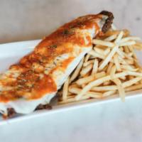 Napolitana Milanesa · Veal or chicken, ham, mozzarella and tomato sauce. Served with your choice of side.