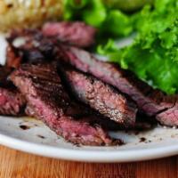 Grilled Skirt Steak · 8-oz. skirt steak grilled to perfection and served with homemade chimichurri. Served with yo...