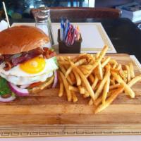 Panizza Burger · 10-oz. beef burger with lettuce, bacon, tomato, mozzarella and fried egg. Served with french...