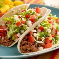 14. Ground Beef California Taco · Hard shell tortillas with cheese, lettuce, tomato and mild salsa.
