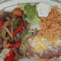 Marinated Steak Fajitas · Served with tortillas, rice, beans and soup or salad.