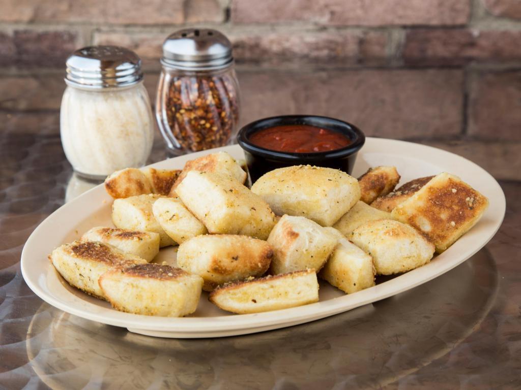 Breadstick Bites · Bite-size topped with Zzeek's shake.