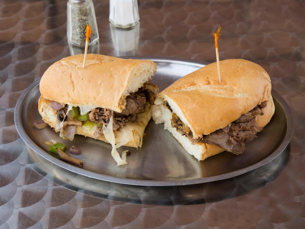 Philly Steak Sandwich · Sliced beef, green peppers, red onions, mushrooms, mozzarella and provolone cheese.