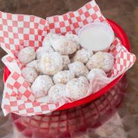 Zepoles · Dough ripped into pieces, deep fried, covered in powdered sugar and served with vanilla fros...