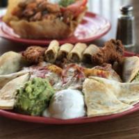 Fiesta Platter · Cheese quesadilla, spicy wings, nachos, taquitos, and tacos served with guacamole and sour c...