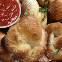 * Fresh Baked Garlic Bread Knots · Drizzled with olive oil and sprinkled with Parmesan.