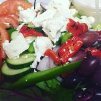 * Greek Salad · Mixed greens, Kalamata olives, tomatoes, cucumbers, red onion, green peppers, roasted red pe...