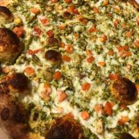 * Chicken Pesto White Pizza · Pulled chicken in our homemade pesto sauce, tomatoes, roasted garlic and mozzarella.