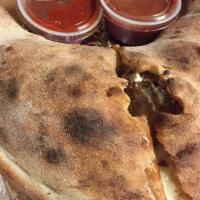 * Steak Bomb Calzone · Lean shaved steak, peppers, onions, mushrooms and American, mozzarella and ricotta cheeses.
