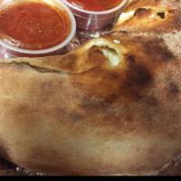 Cheese Calzone · The basic calzone comes with a combination of garlic infused olive oil, fresh ricotta, mozza...