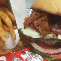 * David's Bacon Burger · All-natural Angus burger broiled with bacon, lettuce, onions and tomatoes. Served with frenc...