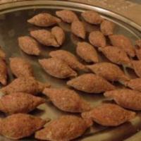 Kebeh Makliyeh · 4 pieces. Cracked-wheat stuffed with ground beef and pine nuts and fried.