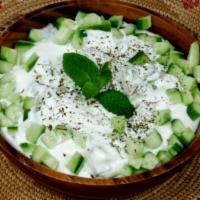 Yogurt Cucumber Salad · Yogurt with cucumber, dried mint and garlic. Vegetarian.