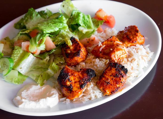 Chicken Kabab · Chunks of chicken breast marinated in garlic, grilled and served with Lebanese salad, rice and secret garlic sauce.