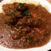 Kafta Stew · Kafta kebab ground beef grilled then sauteed in a tomato garlicky sauce topped with cilantro...