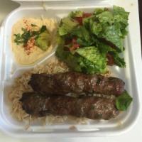 Kafta Kebab · Ground beef marinated in a blend of spiced, onion and parsley just like back home. Served wi...
