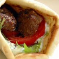 Beef Kabab Sandwich · Filet mignon. Hummus, onion, parsley and pickles garnished with summac.