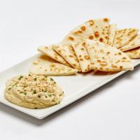 Organic Hummus · A blend of chickpeas, tahini, lemon and spices. Served with pita bread or sliced veggies. Ve...