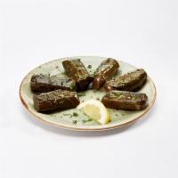 Stuffed Grape Leaves · Grape leaves stuffed with rice, onion and spices. Served with Garlic Feta Sauce. (340 Cals) 
