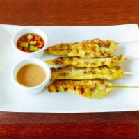 Chicken Satay  · Grilled chicken marinated with coconut milk and curry powder served with peanut sauce and
cu...