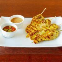 Gluten Free Chicken Satay · Grilled chicken marinated with coconut milk and curry powder, served with peanut sauce and c...