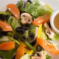 House Salad · Romaine, mushrooms, olives, onions, and tomatoes. Served with choice of dressing.