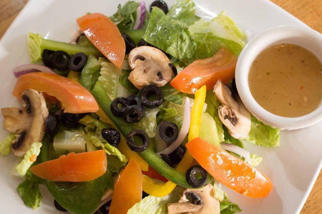 Insalata Della Casa · Spring mix, tomatoes, red onions, bell pepper, pepperoncini, black olives.