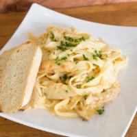 Chicken Alfredo · Sauteed chicken with garlic, herbs and mushrooms tossed in a cream sauce.