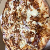 BBQ Chicken Pizza · BBQ sauce, BBQ chicken, red onions, garlic, and feta.