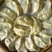 Chicken Momos · Homemade steamed dumplings filled with marinated ground chicken and served with delicious to...