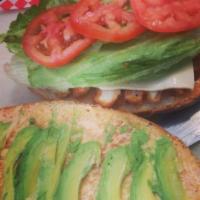 Milanesa Torta · Breaded chicken and Swiss cheese. Served with lettuce, tomato and avocado.