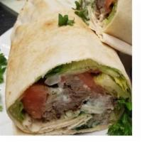 Pork Shish Kebab Wrap · pita bread or a lavash wrap. made with chopped fresh lettuce, tomatoes, onions, parsley, hum...