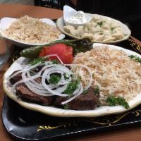 Beef Shish Kebab plate · Filet mignon. Served with pita, BBQ tomato, and Anaheim pepper, 2 salads and a choice of mas...