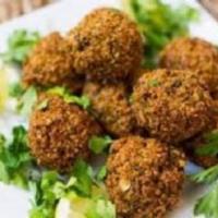 Falafel plate · (vegetarian) Served with pita, BBQ tomato, and Anaheim pepper, 2 salads and a choice of mash...