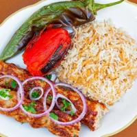 Chicken Lula Kebab plate · Ground chicken with chopped, grilled onions and spices. Served with pita, BBQ tomato, and An...