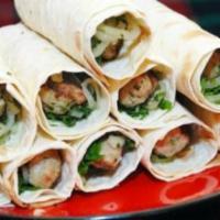 Chicken Lula Kebab Sandwich · pita bread or a lavash wrap. made with chopped fresh lettuce, tomatoes, onions, parsley, hum...