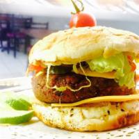 Falafel Sandwich · pita bread, lavash wrap or burger. made with chopped fresh lettuce, tomatoes, onions, parsle...
