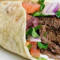 Beef Shawarma Wrap · Pita or Lavash wrap- with lettuce, tomatoes, onions, parsley and sauce.