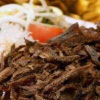 Shawarma Plate · Beef Shawarma with fresh chopped lettuce, tomatoes, onions, and parsley. With a side of humm...