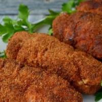 Chicken Kiev · Chicken cutlet made with butter, garlic, herbs, and bread crumbs
