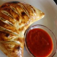 BBQ Chicken Calzone · Grilled chicken breast red onions, cilantro, BBQ sauce, tomato sauce, ricotta and mozzarella...