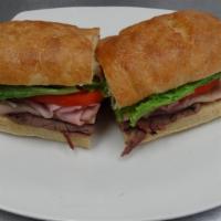 Club Sandwich · Roast beef, turkey, ham, lettuce, tomato, provolone cheese and mayonnaise on ciabatta bread