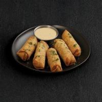 Philly Cheesesteak Egg Rolls · Crispy egg rolls filled with roast beef, peppers, onions and cheese. Served with craft beer-...