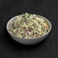 Coleslaw · Slaw mix of red and green cabbage, shredded carrots, and fresh spinach tossed in creamy cole...
