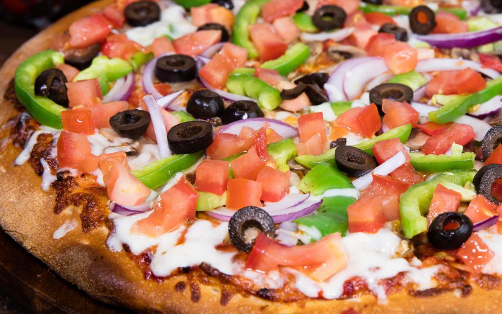 Epic Veggie Pizza · Red sauce, original crust, mozzarella cheese, mushrooms, red onions, green peppers, black olives fresh tomatoes, salt, and pepper.