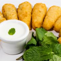 Cream Cheese Poppers · 10 piece. Freshly baked breaded poppers with tater tots, cream cheddar cheese, and jalapeno ...